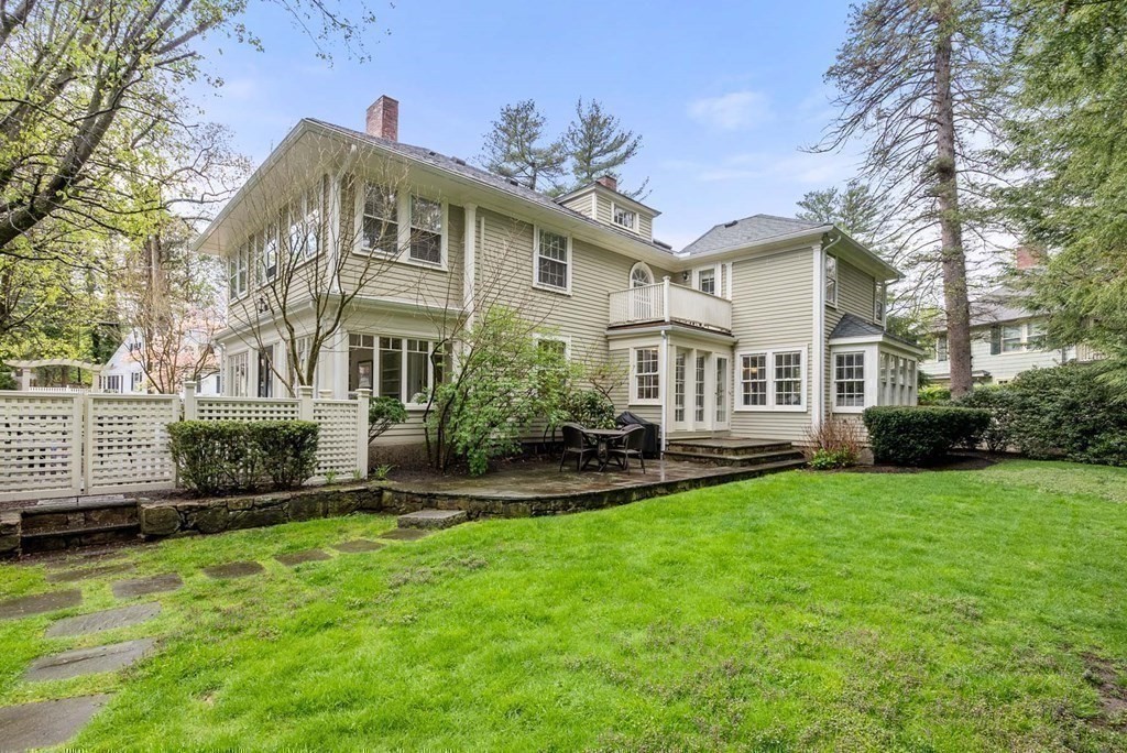 22 Barnstable Road Newton, MA 02465 - Photo 35 of 41 a front view of a house with a yard table and chairs