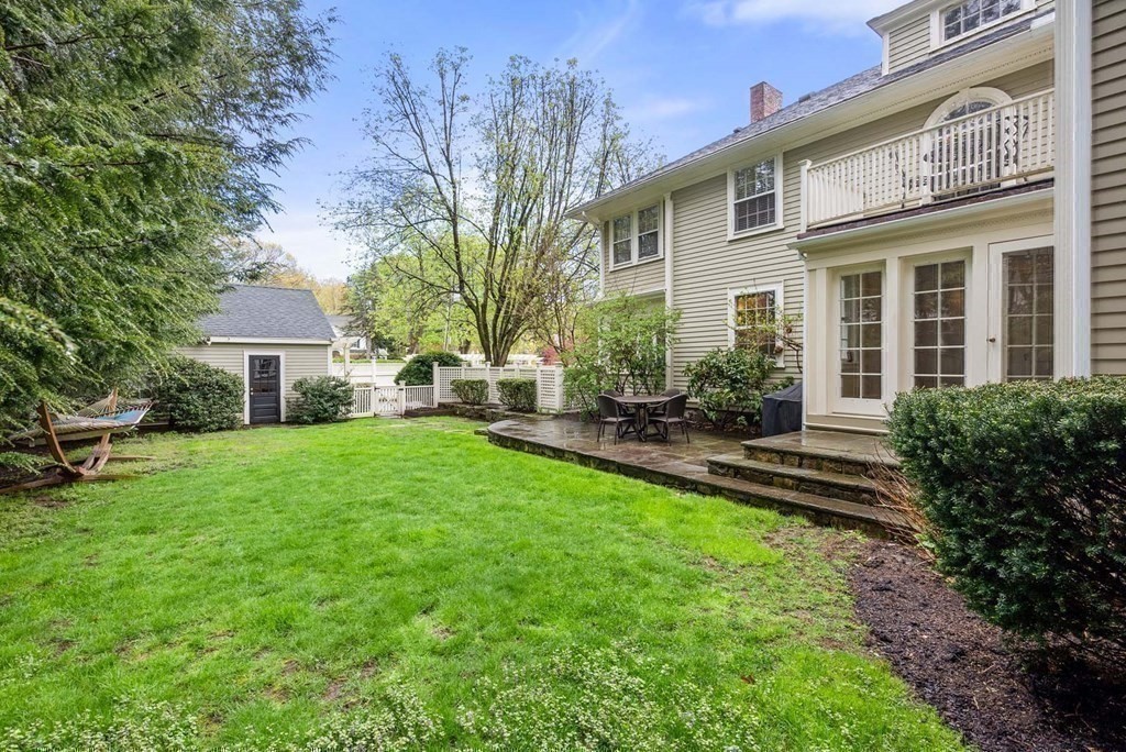 22 Barnstable Road Newton, MA 02465 - Photo 37 of 41 a front view of a house with a yard and seating space