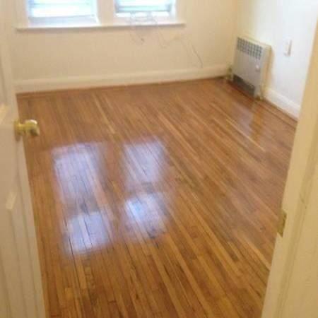 3519 Tryon Avenue Bronx, NY 10467 - Photo 4 of 4 Bedroom with radiator, hardwood finished floors, and baseboards