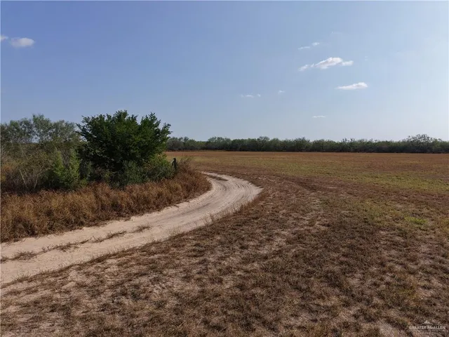 a view of an ocean beach and mountain