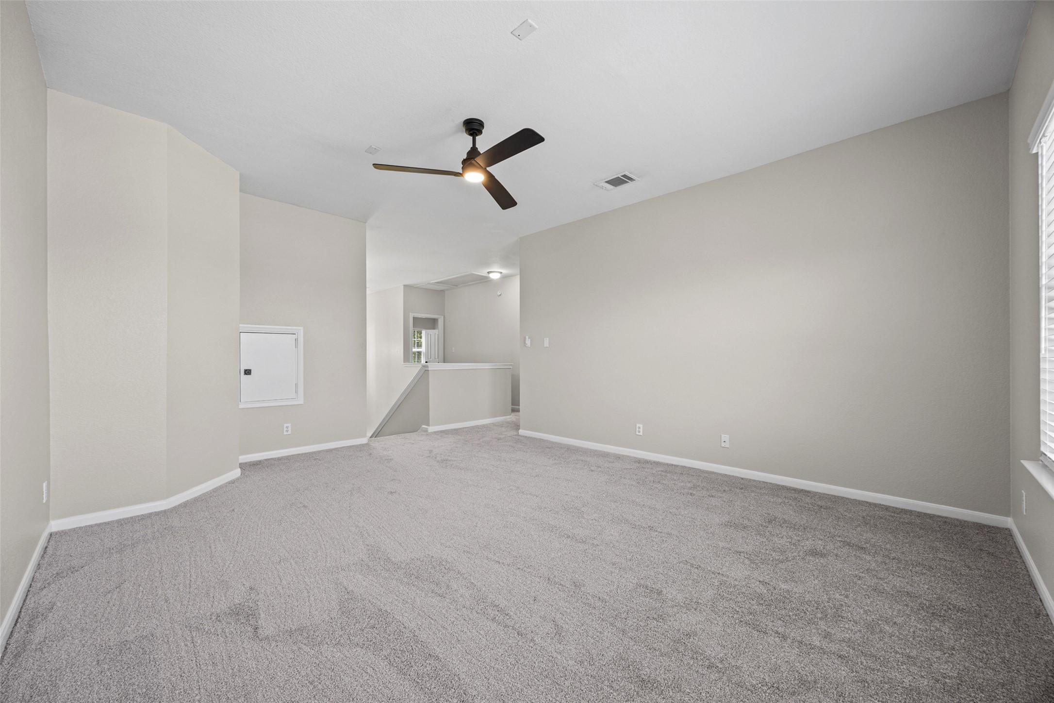 5881 Fergus Kyle, TX 78640 - Photo 24 of 40 Plush carpeting anchors this versatile upstairs living space offering a clean architectural canvas.