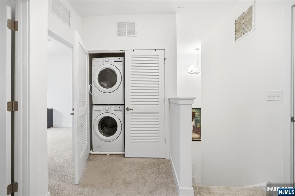 385 Main Street Little Falls, NJ 07424 - Photo 28 of 42 a view of a livingroom with washer and dryer
