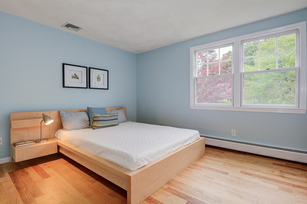 15 Idylwilde Road Lexington, MA 02421 - Photo 15 of 26 a bedroom with a bed and a couch
