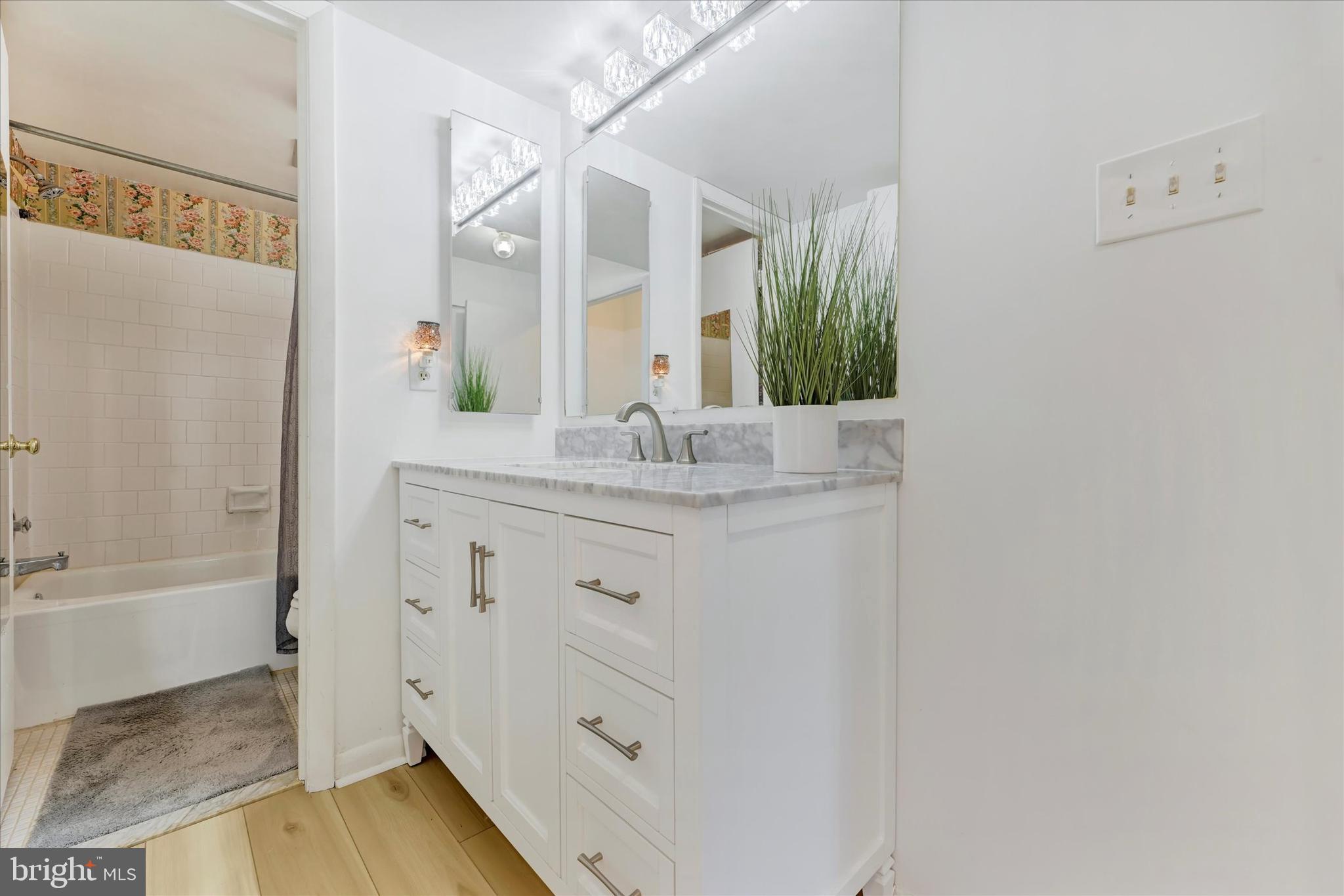 13139 Dairymaid Drive, Unit 99/T1 Germantown, MD 20874 - Photo 11 of 17 a bathroom with a sink and a mirror