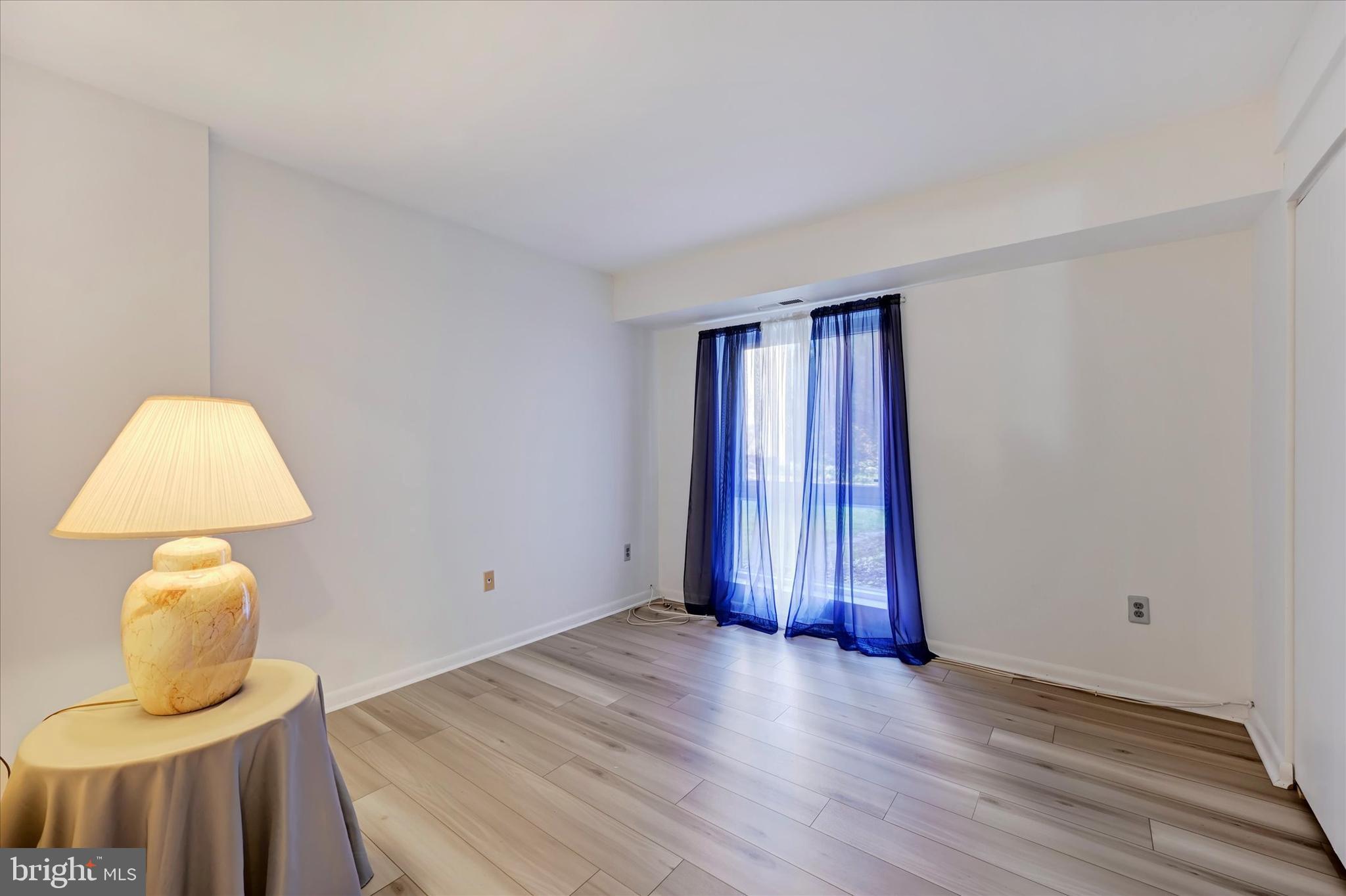 13139 Dairymaid Drive, Unit 99/T1 Germantown, MD 20874 - Photo 13 of 17 a view of a room with wooden floor