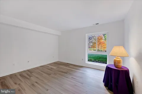 a very nice looking room with a big bed and a window