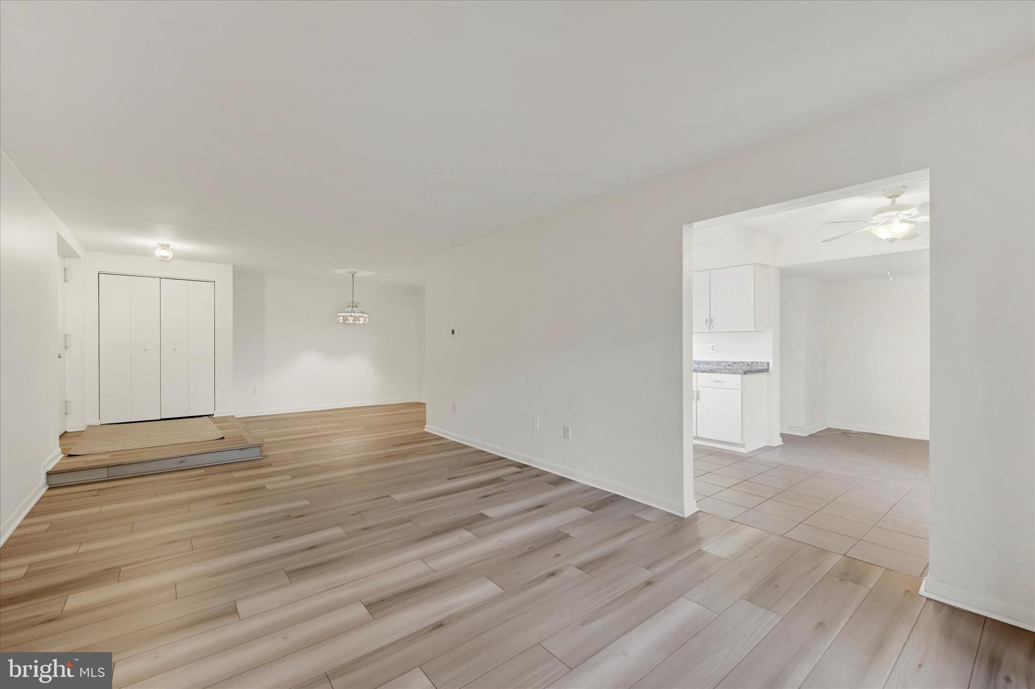 13139 Dairymaid Drive, Unit 99/T1 Germantown, MD 20874 - Photo 10 of 17 a view of empty room with wooden floor