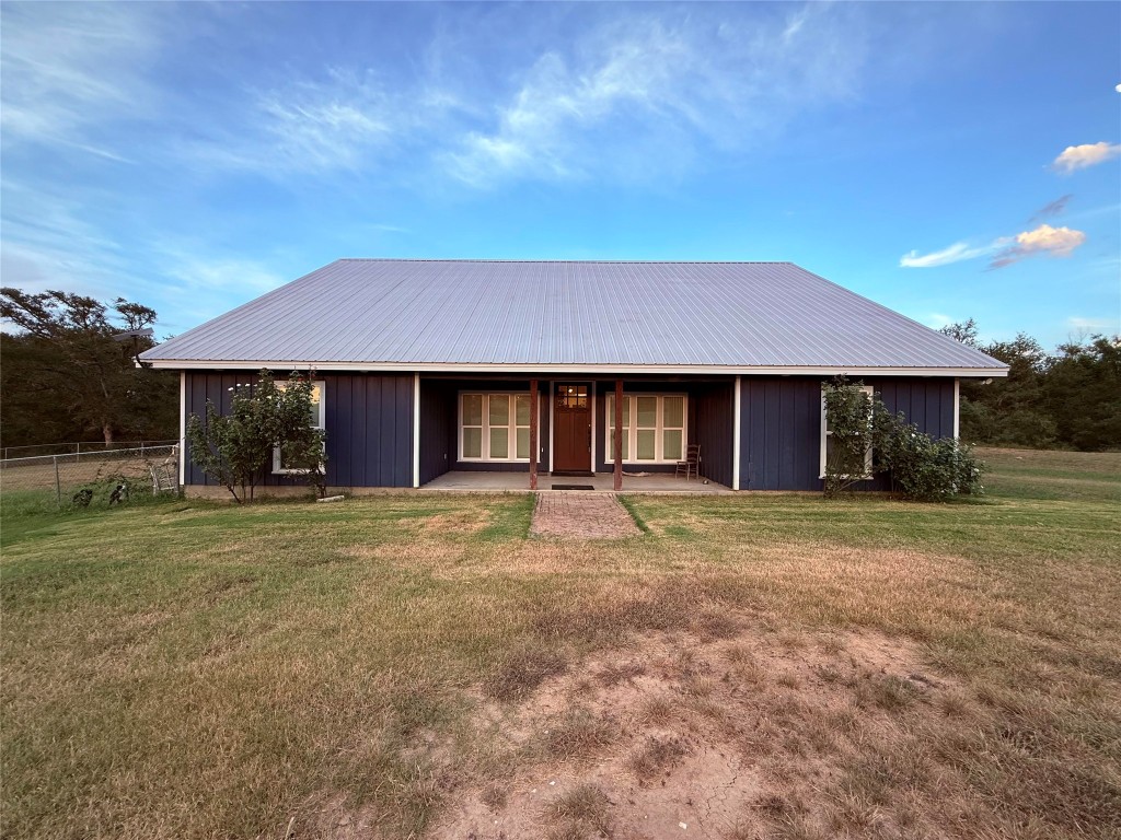 View of front of property featuring a metal roof