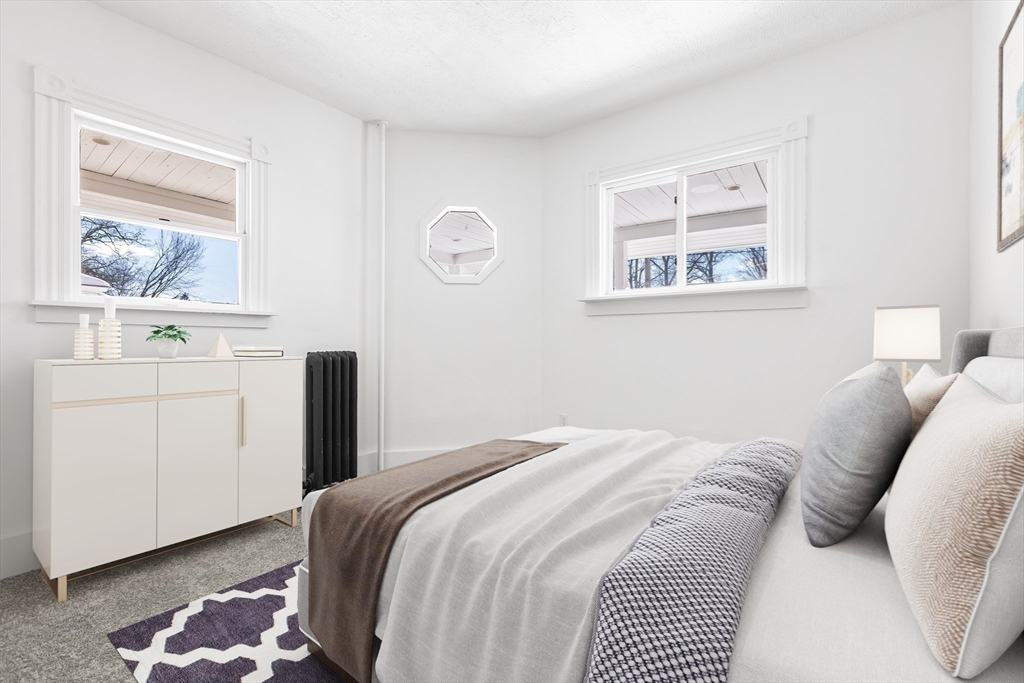 232 Pequoig Avenue, Unit 2 Athol, MA 01331 - Photo 11 of 17 a bedroom with a bed and a window