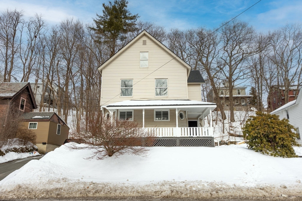 232 Pequoig Avenue, Unit 2 Athol, MA 01331 - Photo 2 of 17 a front view of a house with a yard covered in snow