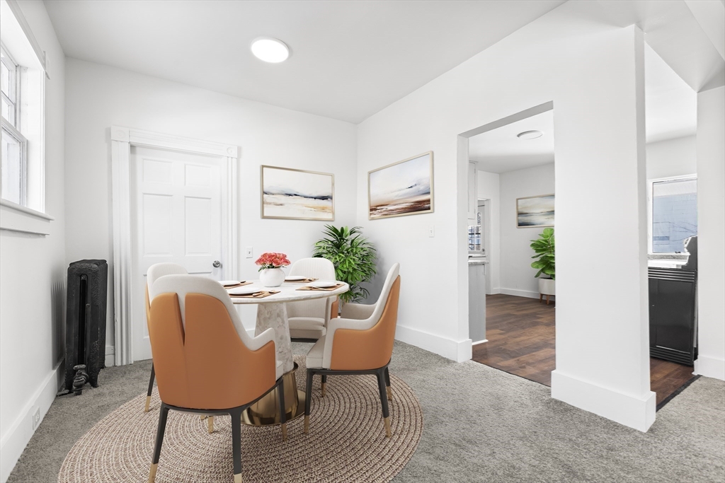 232 Pequoig Avenue, Unit 2 Athol, MA 01331 - Photo 9 of 17 a dining room with furniture and wooden floor