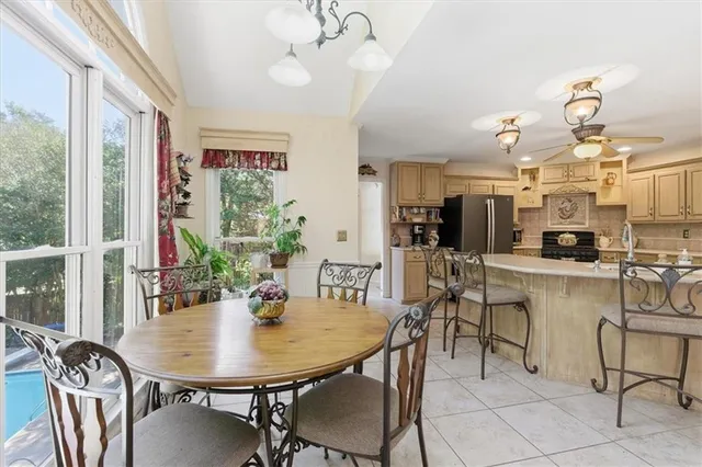 a living room with furniture a rug and a window
