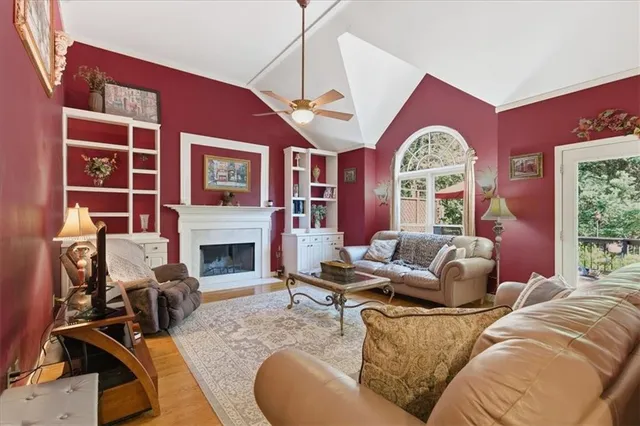 a bathroom with a sink vanity granite tub shower and a mirror