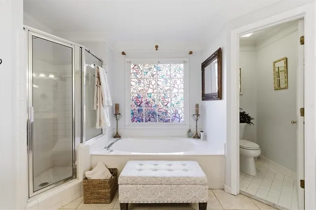 a view of a hallway with wooden floor and entryway