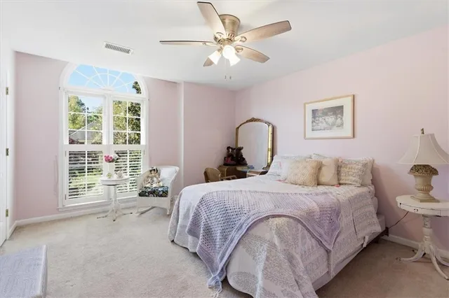 a view of a livingroom with workspace and a window