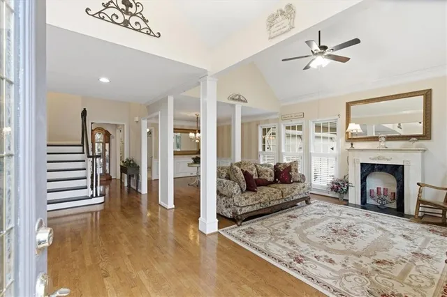 a living room with furniture and a fireplace