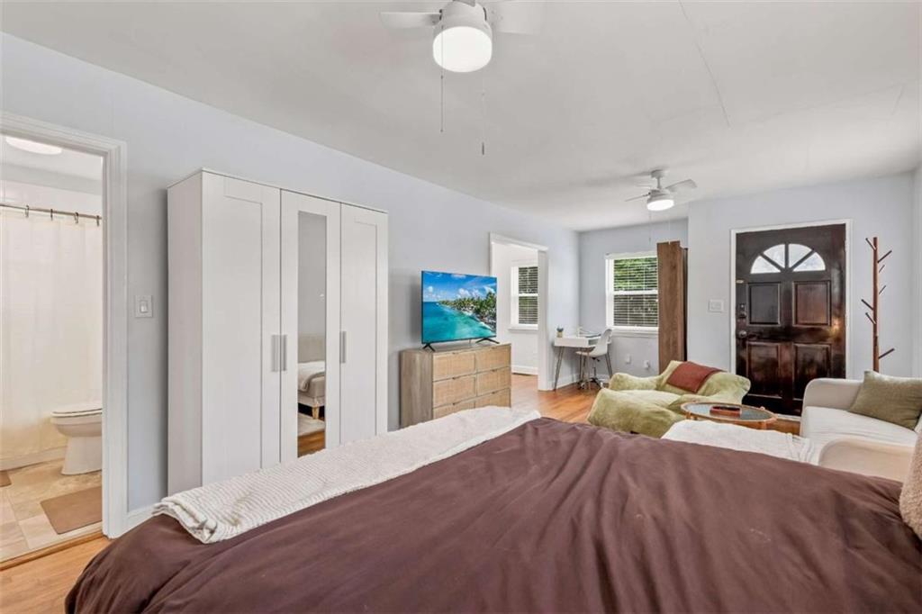 1780 John Calvin Avenue, Unit R College Park, GA 30337 - Photo 8 of 12 a bedroom with furniture and a large window