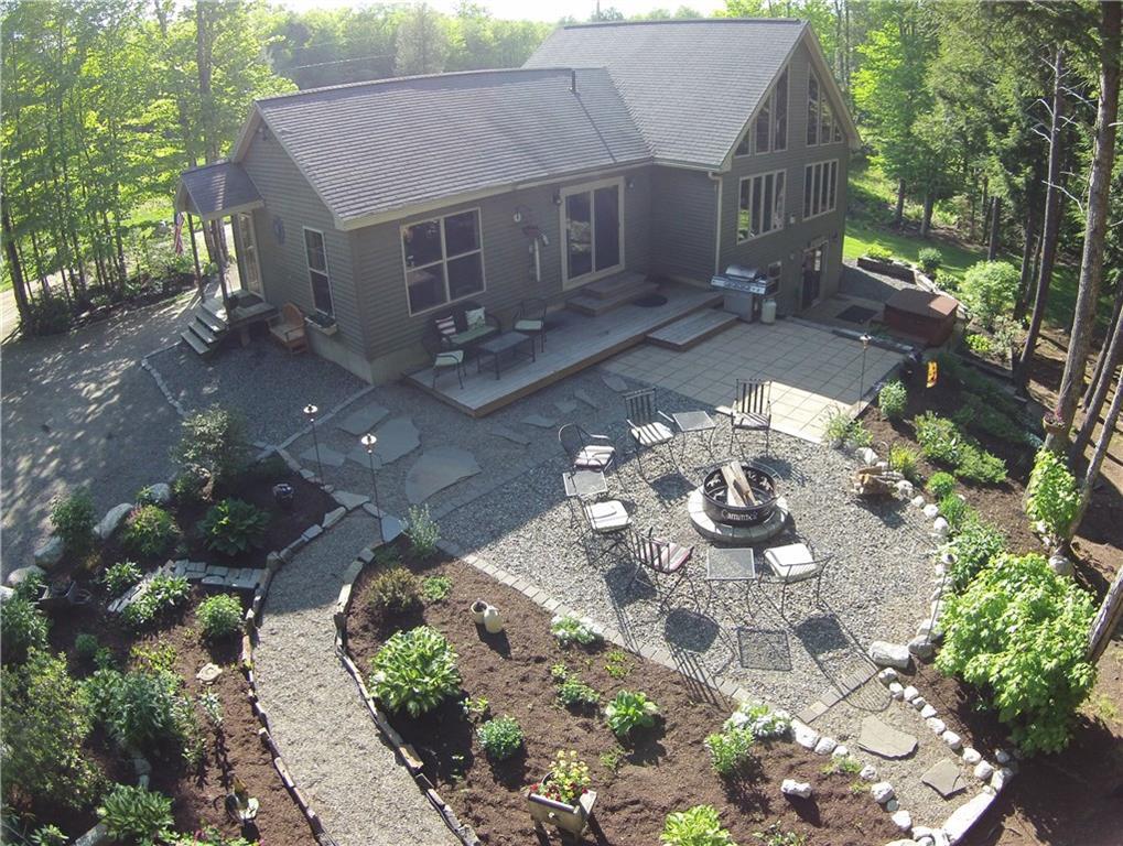 562 Springy Pond Road Ellsworth, ME 04605 - Photo 7 of 33 Upper patio leads to firepit area...