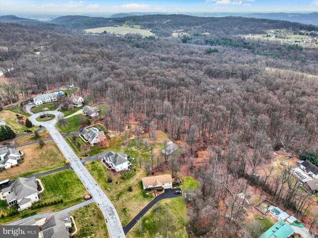 a aerial view of a house with a yard