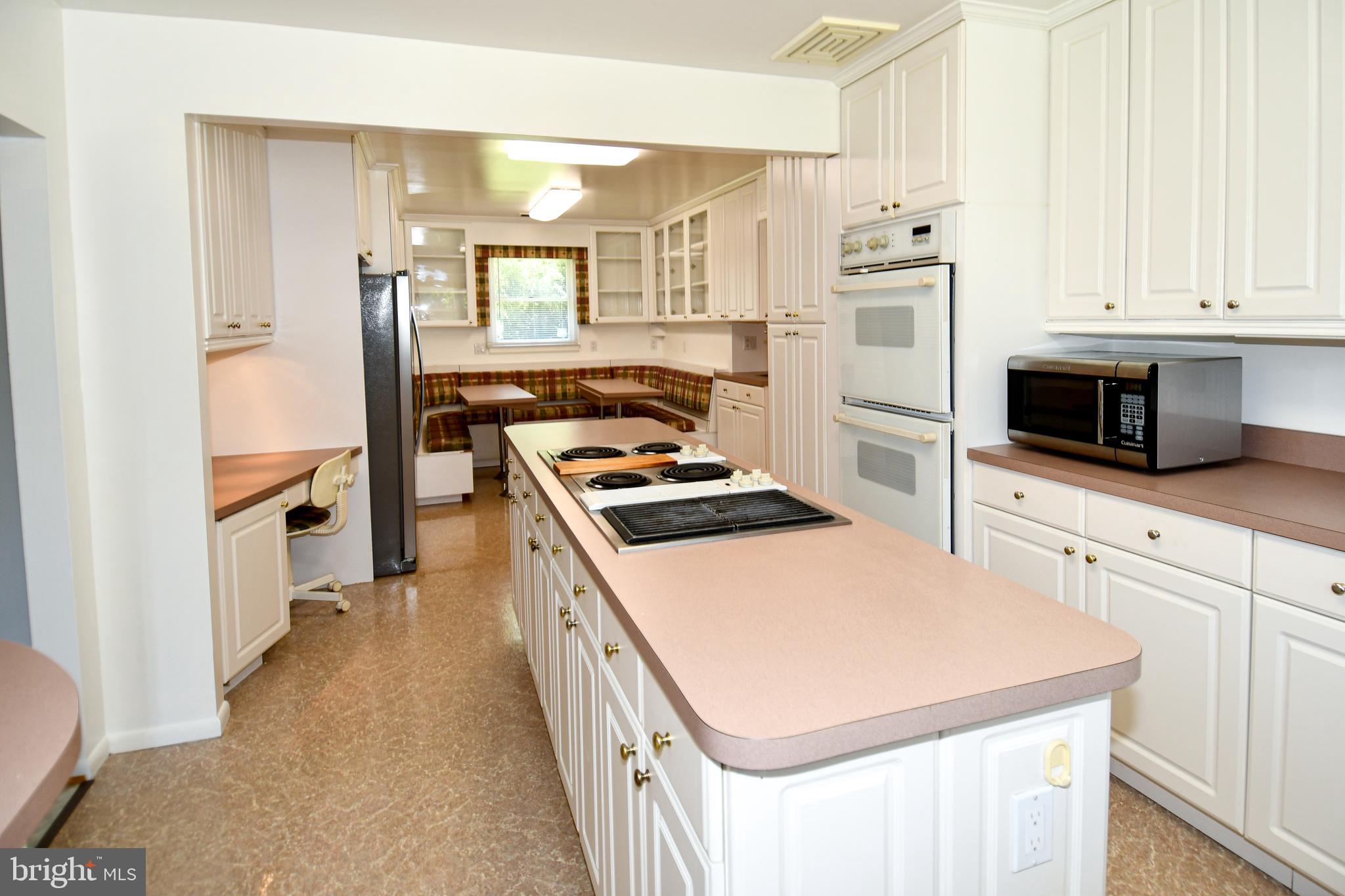 14405 Duckett Road Brandywine, MD 20613 - Photo 11 of 52 ISLAND HAS ELECTRIC STOVE TOP & BUILT-IN DESK