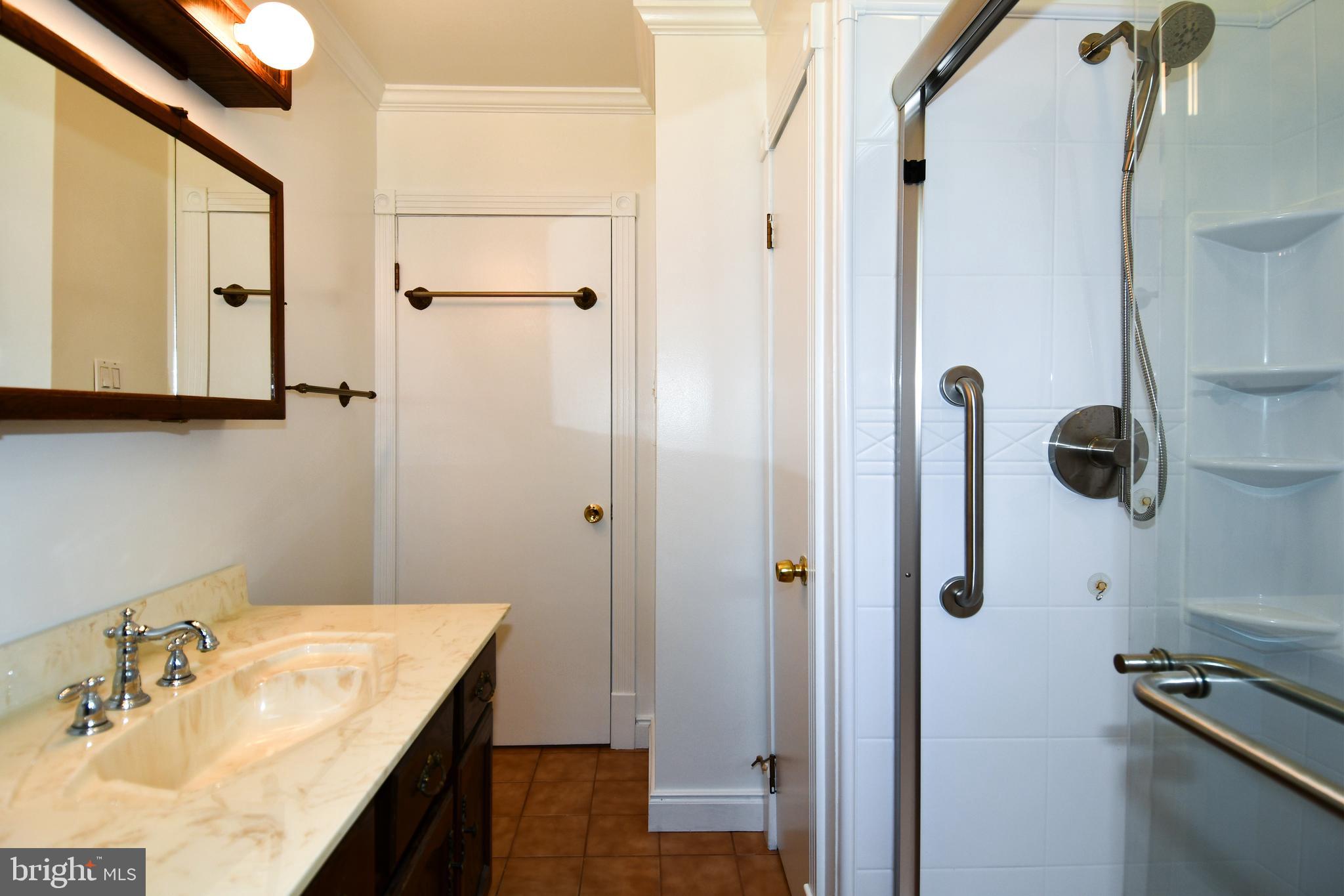 14405 Duckett Road Brandywine, MD 20613 - Photo 22 of 52 HALLWAY BATHROOM HAS LINEN CLOSET