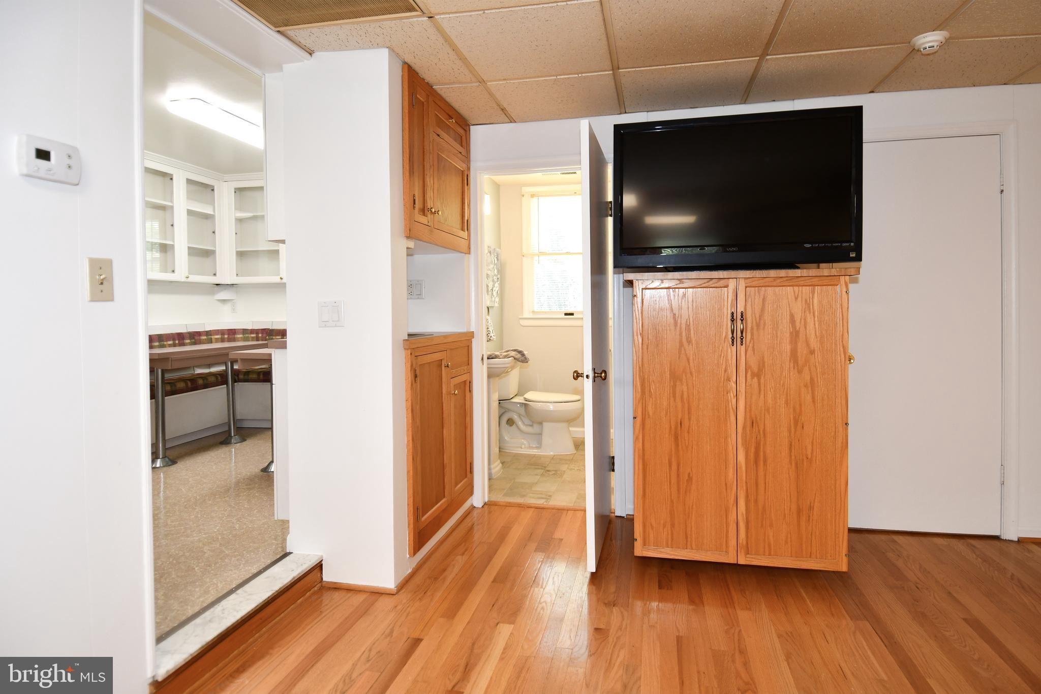 14405 Duckett Road Brandywine, MD 20613 - Photo 32 of 52 FAMILY ROOM OFF KITCHEN HAS BUILT-IN CABINET