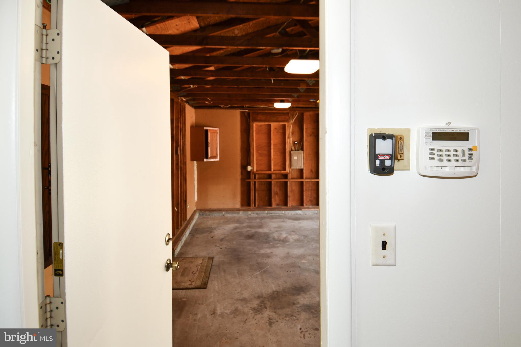 14405 Duckett Road Brandywine, MD 20613 - Photo 47 of 52 FAM RM ACCESS TO GARAGE. OPENERS ON RIGHT WALL