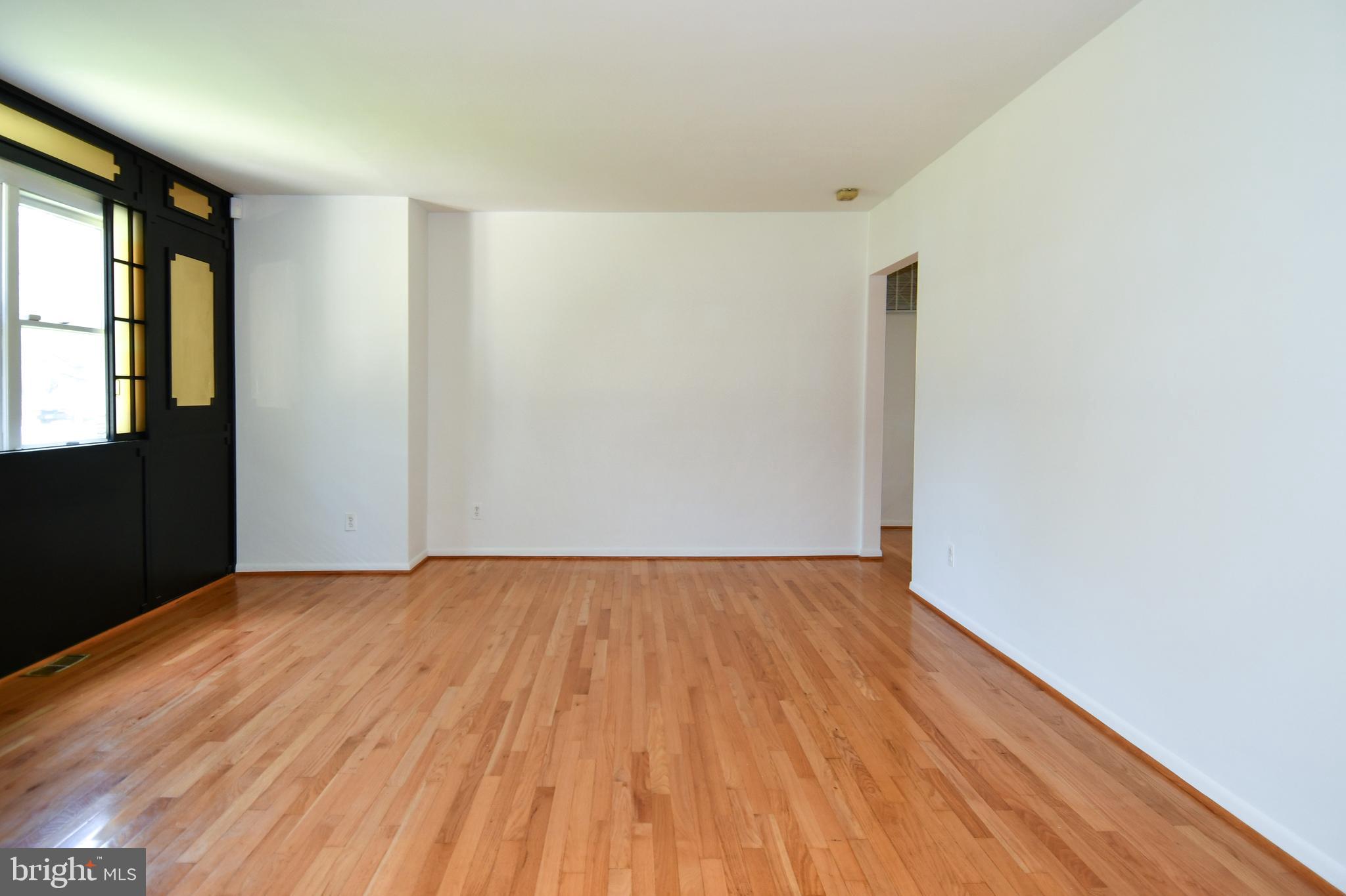 14405 Duckett Road Brandywine, MD 20613 - Photo 7 of 52 LIVING ROOM HAS DOOR ACCESS TO HALLWAY BEDROOMS