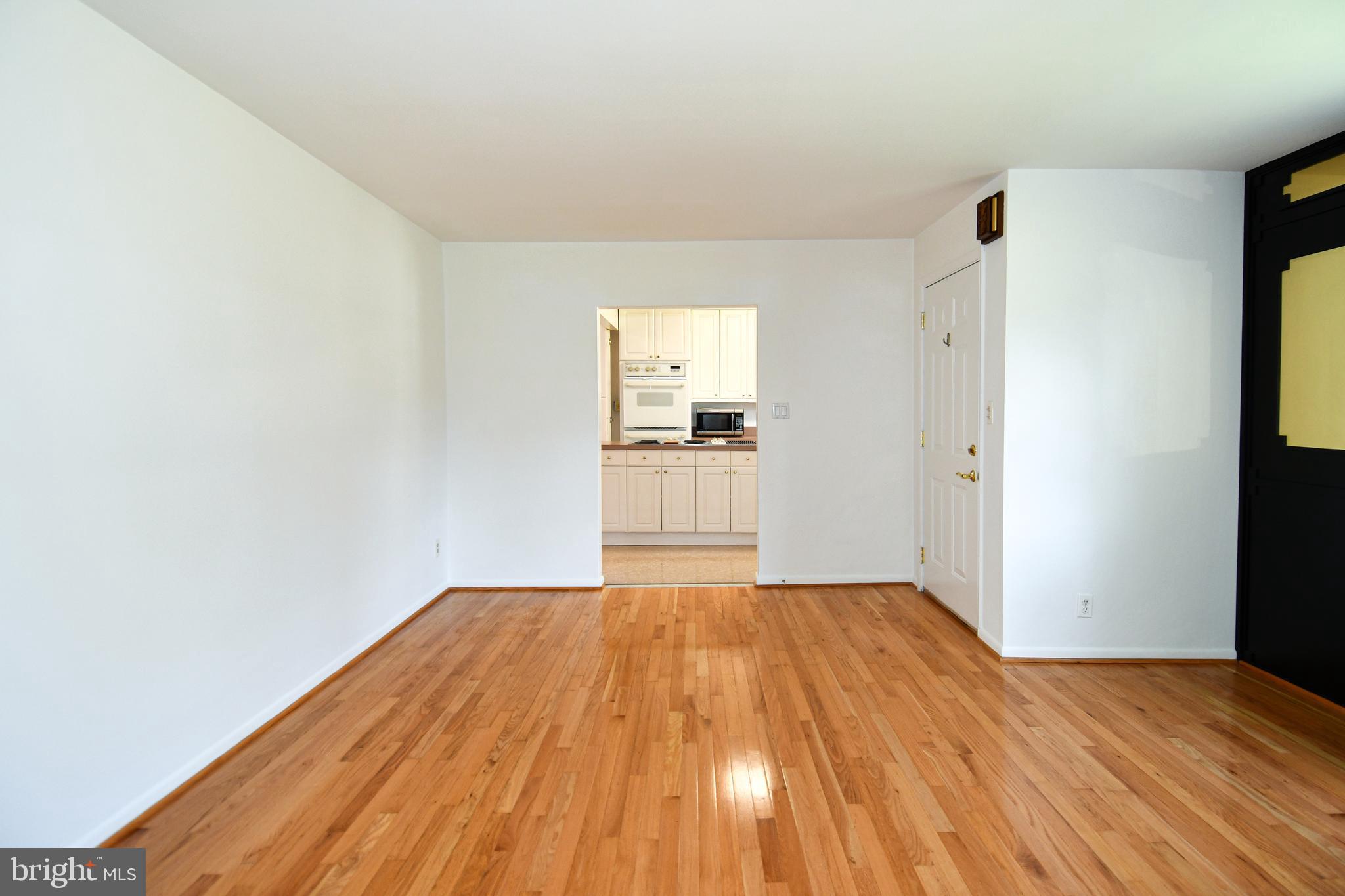 14405 Duckett Road Brandywine, MD 20613 - Photo 9 of 52 LIVING ROOM DOOR ENTRANCE TO KITCHEN