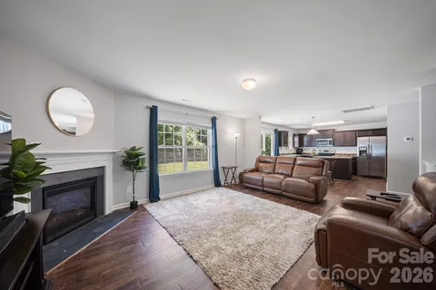 a kitchen with a table chairs refrigerator and microwave