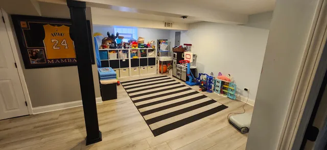 a living room with furniture and a rug