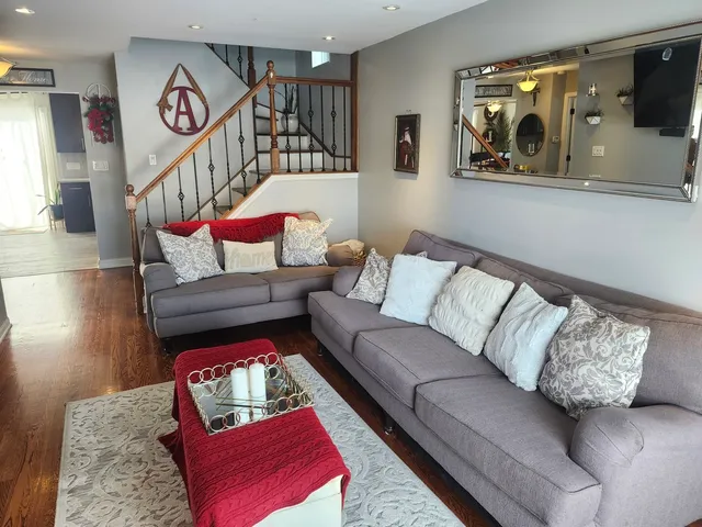 a living room with furniture and a rug