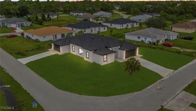 an aerial view of a house with garden space and outdoor space