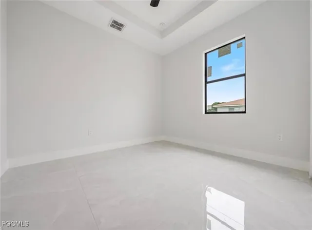 a kitchen with stainless steel appliances a sink a stove a refrigerator a center island and cabinets