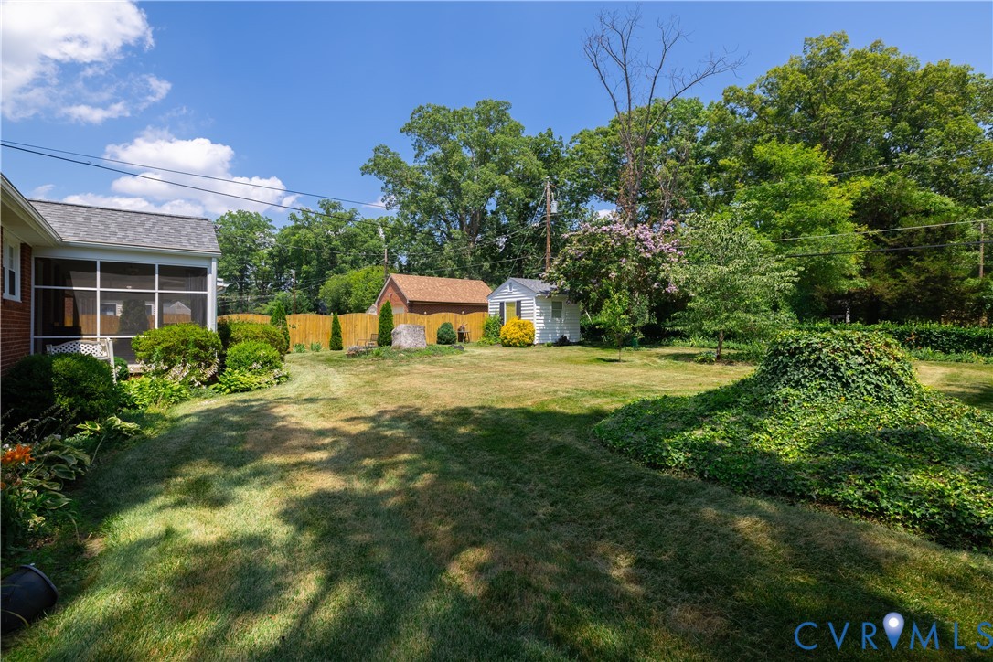 1107 Ridgecrest Drive Henrico, VA 23229 - Photo 25 of 26 Spacious rear yard featuring green lawn, mature tr
