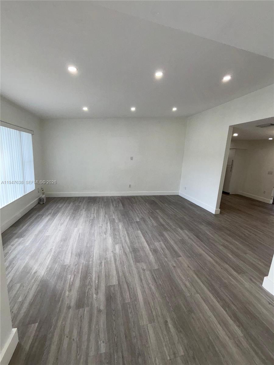 11105 Southwest 156th Terrace Miami, FL 33157 - Photo 12 of 23 an empty room with wooden floor and entrance