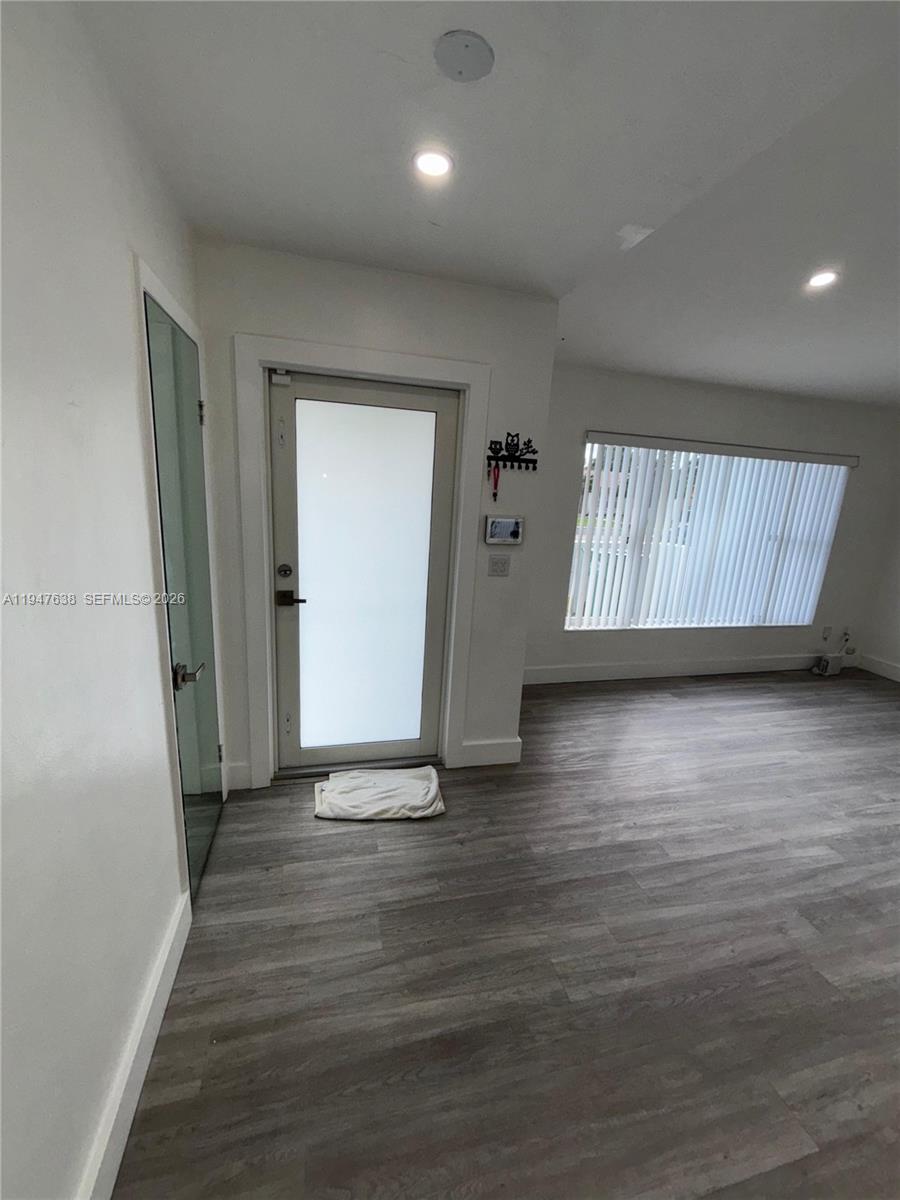11105 Southwest 156th Terrace Miami, FL 33157 - Photo 14 of 23 an empty room with wooden floor and windows