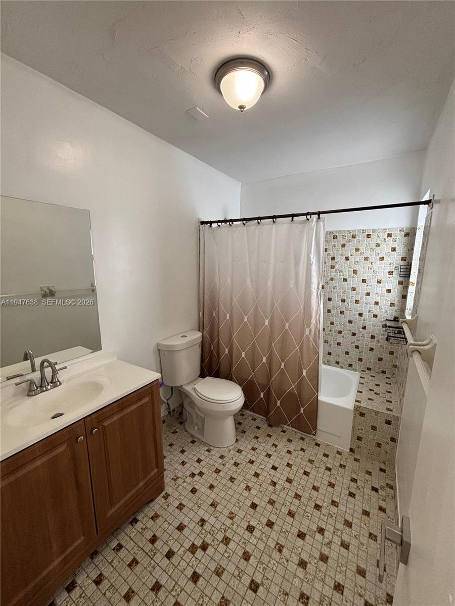 11105 Southwest 156th Terrace Miami, FL 33157 - Photo 21 of 23 a bathroom with a sink toilet and shower