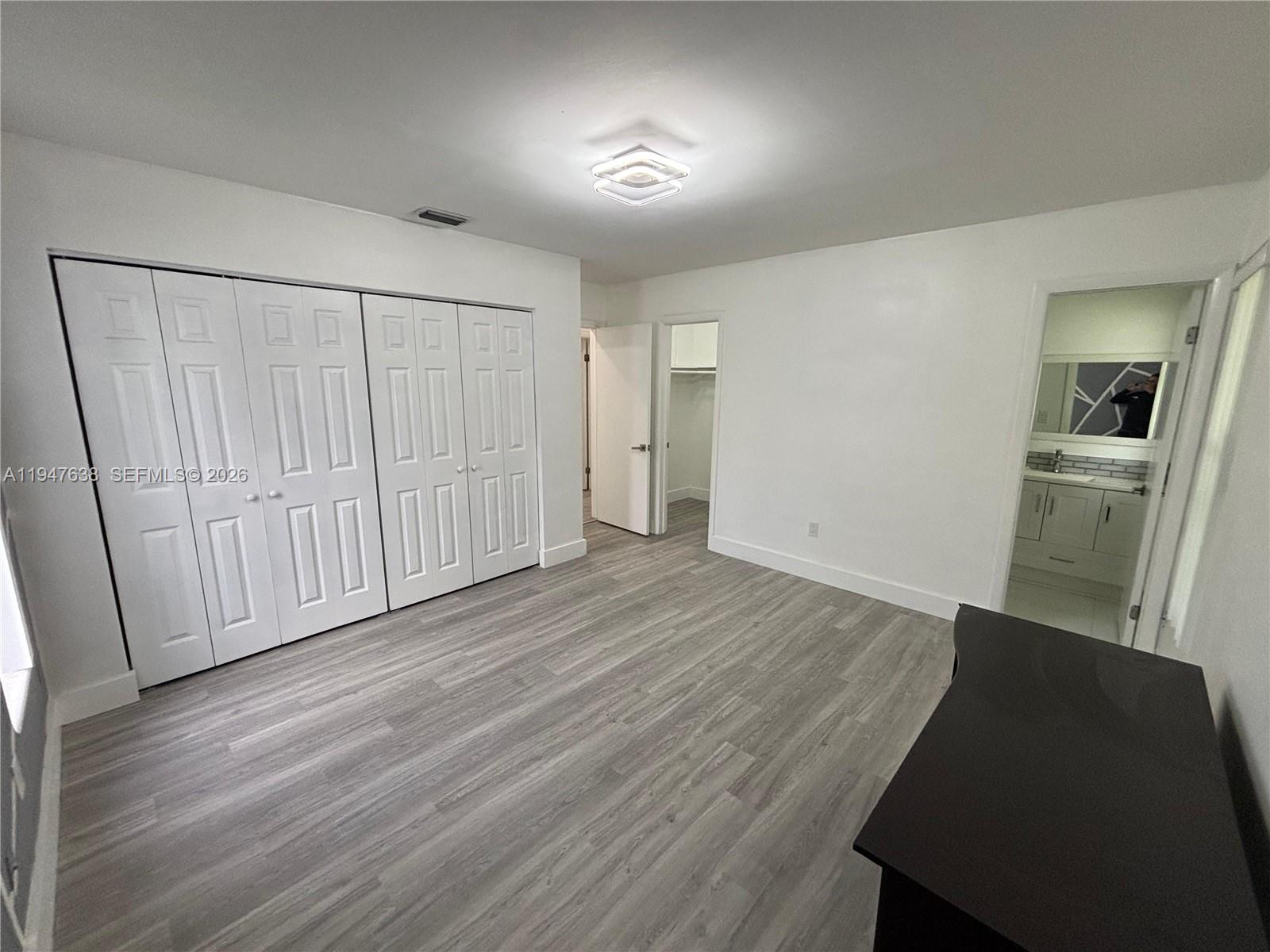 11105 Southwest 156th Terrace Miami, FL 33157 - Photo 23 of 23 wooden floor in an empty room