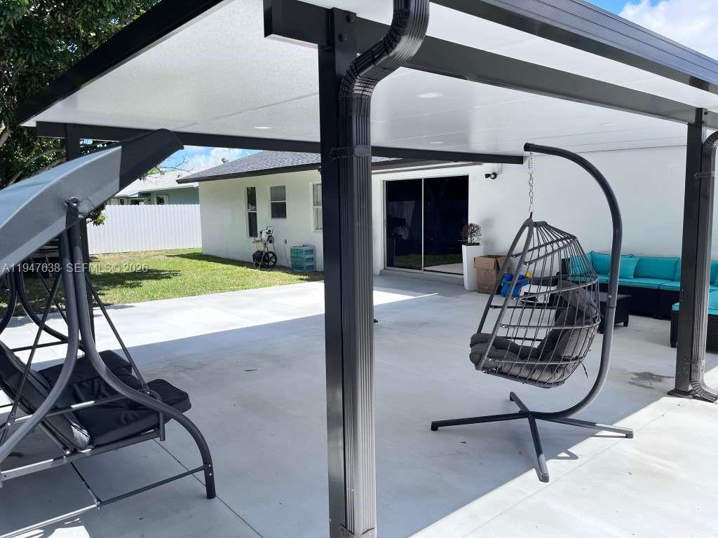 11105 Southwest 156th Terrace Miami, FL 33157 - Photo 8 of 23 a view of a swimming pool with a patio and a yard