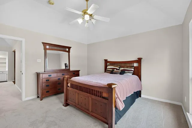 a spacious bathroom with a double vanity sink mirror and toilet