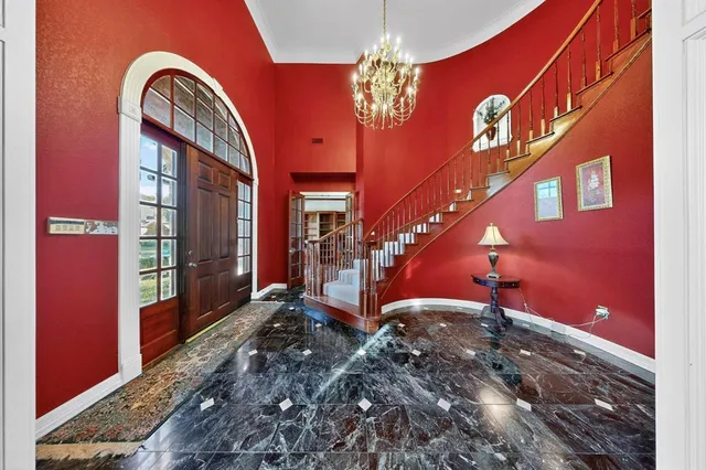 a living room with furniture window and wooden floor