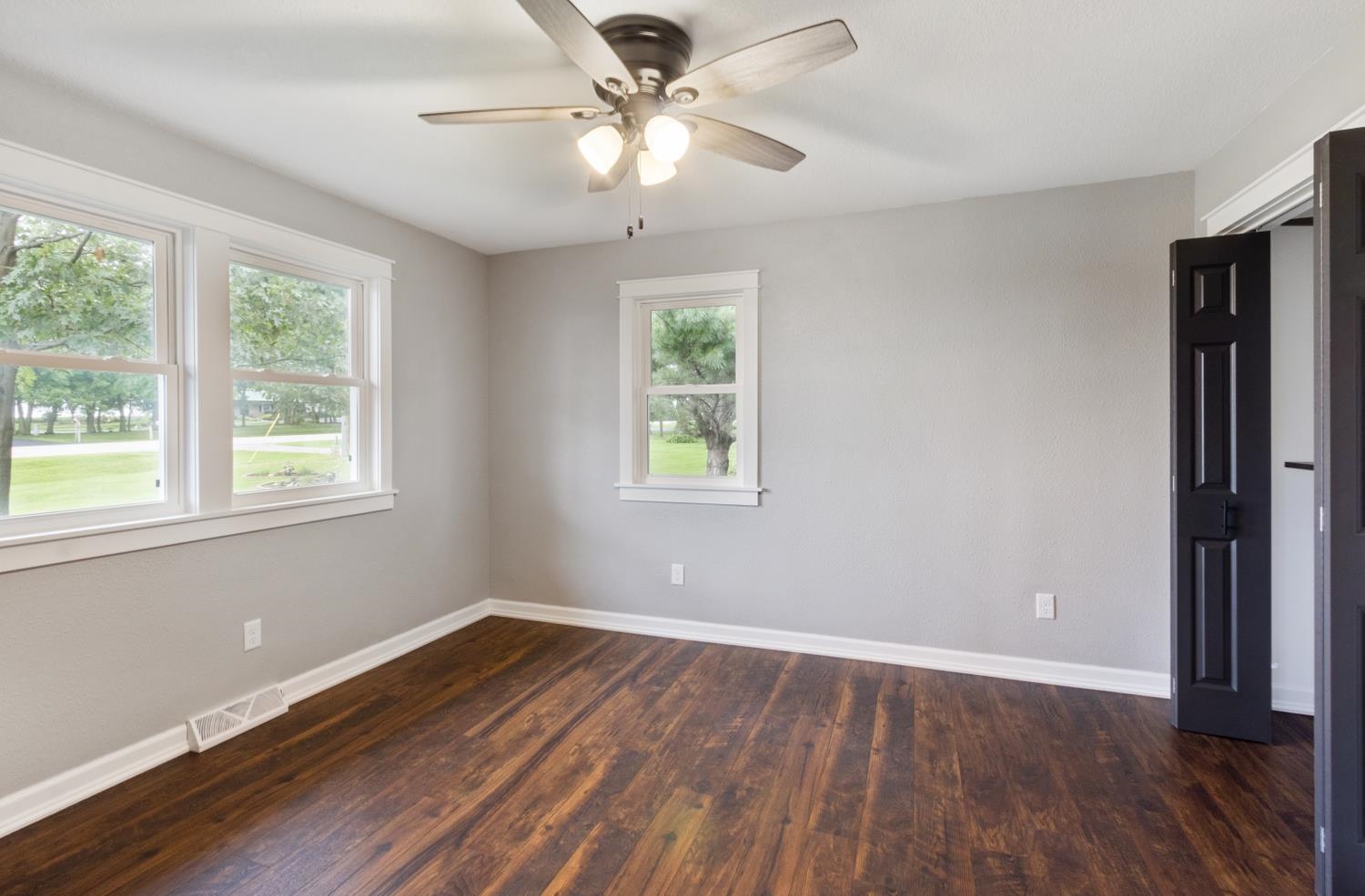 2072 Highway 26 Dixon, IL 61021 - Photo 13 of 30 a view of an empty room with wooden floor and a window