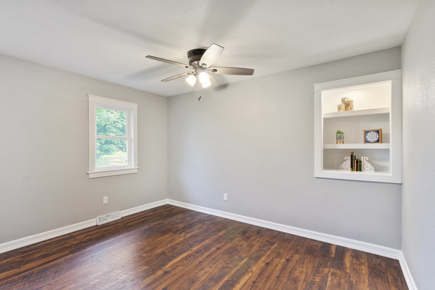 2072 Highway 26 Dixon, IL 61021 - Photo 17 of 30 a view of empty room with wooden floor and fan