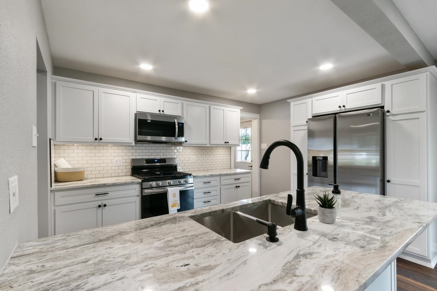 2072 Highway 26 Dixon, IL 61021 - Photo 10 of 30 a kitchen with a sink stainless steel appliances and white cabinets