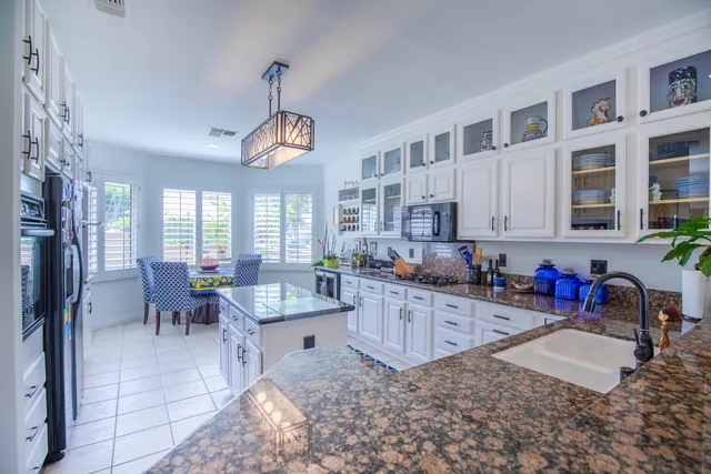 a kitchen with granite countertop lots of counter top space