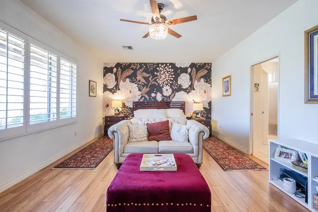 a bedroom with a bed and a couch