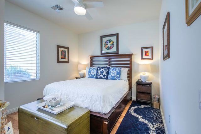 a bedroom with a bed and a table