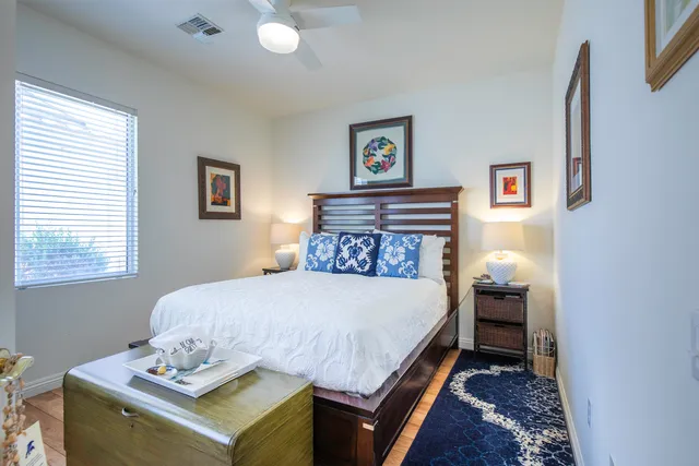 a bedroom with a bed and a table