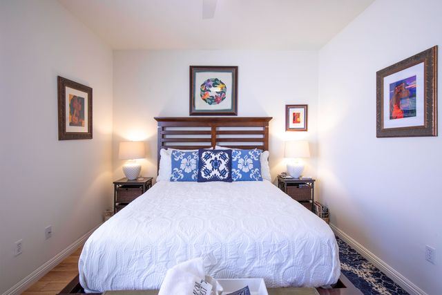 a bed sitting in a bedroom next to a small yard